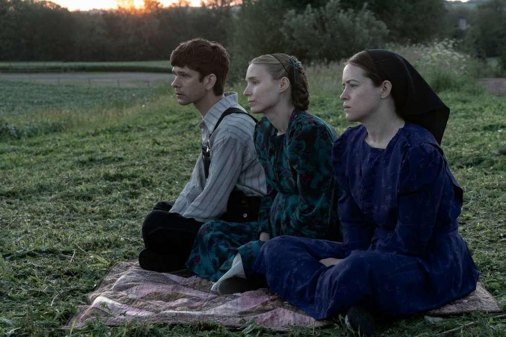 WT_02993_R4(l-r.) Ben Whishaw stars as August, Rooney Mara as Ona and Claire Foy as Salomein director Sarah Polley’s filmWOMEN TALKINGAn Orion Pictures ReleasePhoto credit: Michael Gibson© 2022 Orion ...